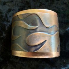 "Big, bold copper cuff with a flame motif. Copper has been antiqued. Measures approx. 2\" wide by 6\" long. Adjustable.  Completely hand forged from copper sheet. Sealed with acrylic to minimize skin discoloration.  Each cuff is as unique as its owner! PLEASE NOTE: We may make cuffs to order; therefore, the exact cuff you receive may vary slightly from what is pictured. However, the design and colors will remain the same unless you request different colors." Copper Sheets, Copper Cuff, Skin Discoloration, Jewelry Bracelet, Handmade Artisan, Hand Forged, Adjustable Bracelet, Art Jewelry, Jewelry Art