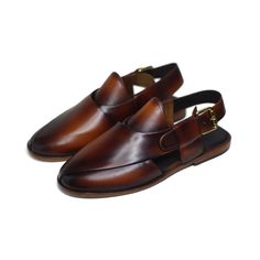 Exquisitely crafted with supple leather, this peshawari chappal would compliment any eastern ensemble. In a rich hickory color, it encapsulates elegance and comfort. All designs are made to order and each piece is uniquely created with a personality in mind; strong, significant, and one-of-a-kind. Finished product is delivered within 18-20 days after order is received. We are a small-scale handmade shoes brand operating from Pakistan. We specialize in a variety of handmade men's leather footwear Eastern Wear, Formal Dress Shoes, Mens Shoes Sandals, High Ankle Boots, Semi Formal Dress, Cow Calf, Mens Fashion Suits, Buffalo Leather, Leather Mules