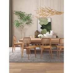 a dining room table with chairs and a plant in the corner on top of it