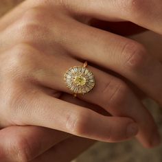 a woman's hand with a ring on it