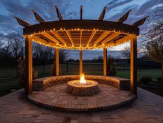 an outdoor fire pit with lights on it