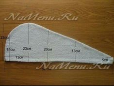 the measurements for an oven mitt on top of a wooden table