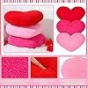 a collage of pink and red heart shaped pillows with crocheted hearts on them