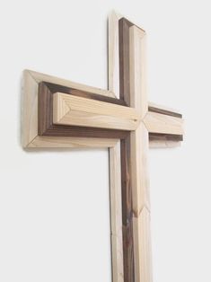 a wooden cross hanging on the wall