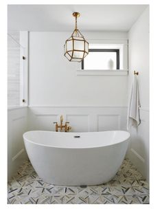 a white bath tub sitting next to a window