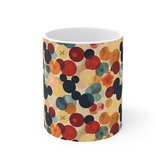 mickey mouse coffee mug with multicolored circles on it