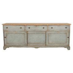 the sideboard has three drawers and two doors