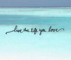 the words live are life you love written in black ink on a blue ocean background