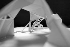 an origami sculpture is shown in black and white