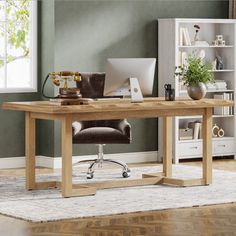 a wooden desk with a computer on top of it in a living room next to a bookcase