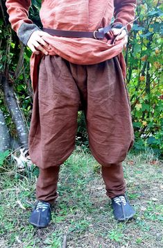 This listing is for a pair of Viking Rus style pants,  they are made of medium weight chocolate brown 100% linen. I like this color for my son because he's always rolling in the dirt! They have elastic waist and are very loose fitting in the upper portion with a more fitted lower leg. Goes great with a tunic!  Machine washable and dry-able. (Tunic, belt, and shoes not included) SIZE CHART WaistLengthCalf Circumference  6-9 months17"-19"15.5"up to 7.5" 12-18months...18"-20"16.5"up to 8" 2T19"-21"18"up to 8" 3T20"-22"19"up to 9" 4T21"-23"21"up to 9" 5/623"-25"24.5"up to 9.5" 7/825"-26"29.5"up to 10.5" 9/10"26"-27"35"up to 11.5" 11/1227"-29"39"up to 13" 13/1428"-30"41.5"up to 14" Viking Pants, Coos Bay, Ren Fair, Linen Tunic, Lower Leg, Style Pants, Clothing Ideas, Kids Costumes, My Son