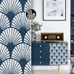 a blue dresser with an art deco print on it