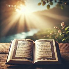 an open book sitting on top of a wooden table next to a tree and water