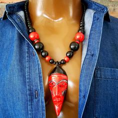 African mask pendant necklace ~ D E T A I L S ~ ~  10mm, 14mm and 20mm wood .   beads ~  hand carved mask pendant from  .   Kenya ~  length +- 3 3/4" (9.5cm) ~  the pendant is hand carved and  .   handpainted so it will differ slightly  .   from the picture ~  lobster clasp ~  handmade necklace  ~ LENGTH ~ Choose from drop down menu ~ S H I P P I N G  ~ Please see the Announcement on our shop Carved Mask, African Beads Necklace, Mask Necklace, Necklace Mens, African Mask, Ethnic Necklaces, African Masks, African Beads, Handmade Necklace