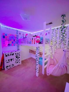 a bedroom decorated in pink and purple lights