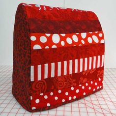 a red and white bag sitting on top of a table