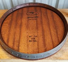 a wooden barrel sitting on top of a table