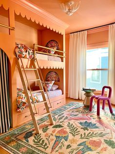 a room with bunk beds and colorful rugs in front of the window, two children's chairs