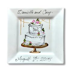 a white plate with a wedding cake on it and the words danielle and cosy written in cursive writing