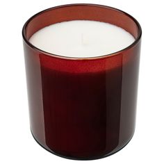 a candle that is sitting in front of a white background