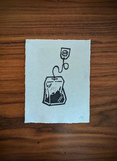 a piece of paper with a drawing of a fish in a tank on it's side