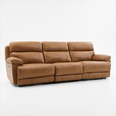 a brown leather couch with two recliners on it's back legs and arms