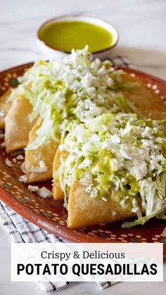 crispy and delicious potato quesadillas on a plate with green dipping sauce