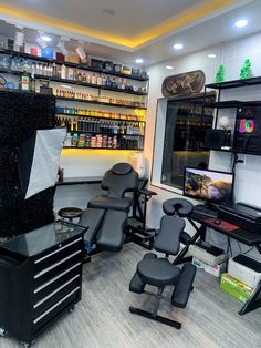 a barber shop with chairs and shelves full of products