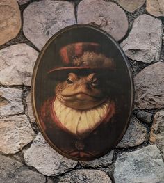 a frog wearing a top hat and standing in front of a stone wall