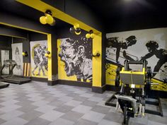 the gym is decorated with yellow and black accents