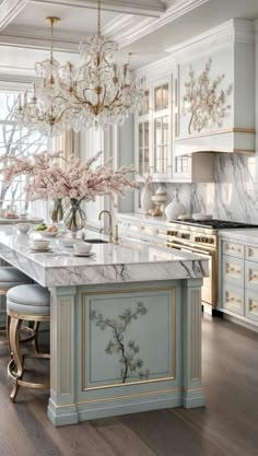 a large kitchen with marble counter tops and an island in front of a window that has flowers on it