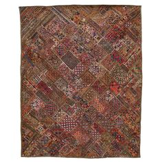 an old rug with many different colors and patterns on it, including red, brown, blue