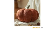 an orange pumpkin sitting on top of a table