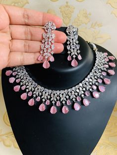 CZ Diamonds Necklace Earrings Set, Pink Bridal Necklace Earrings Antique Jewelry Set, Statement Choker Necklace Earrings, Engagement Set ITEM DESCRIPTION Metal = Antique Plated Occasion = Wedding, Party Wear, Bridal Color = White and Pink Size = Necklace Length = 7 Inches Long, Earring Size = 2.5 Inches Long, Free Shipping 100% Satisfaction Guarantee: 1 Year Warranty, Long Lasting Plating, High-Quality Stones Occasion: Perfect choice for any Indian occasion. Care: It is advisable that you keep p Pink Jewelry Set, Engagement Necklaces, American Diamond Necklaces, Jewelry Set Design, Bridal Choker, Diamonds Necklace, Bridal Fashion Jewelry, Indian Jewelry Sets, Pink Bridal