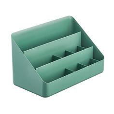 a green desk organizer with three compartments on each side and four dividers in the middle