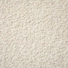 a close up view of a white carpet