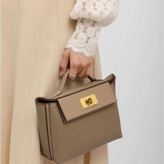 This Mini Top Handle, Crossbody, Shoulder Handbag Is Similar To The Hermes 24/24 Handbag. It Is Made Of Pu/Faux Gray Leather. It Comes With A Strap That Can Be Worn Multiple Ways. There Are No Logos On This Handbag. It Measures 8.7 Inches Long, 3.5 Inches Wide, And 7.1 Inches High. This Item Is Brand New With Packaging Still Intact, Please Refer To Last Photo. Logos, Hermes 24/24 Bag, Hermes Shoulder Bag, Hermes 24/24, Aldo Purses, Small Travel Bag, Fall Handbags, Mini Top, Bag Collection