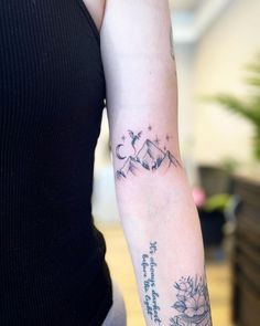 a woman with a tattoo on her arm