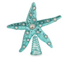 a blue starfish decoration on top of a spiral wire tree ornament with pearls