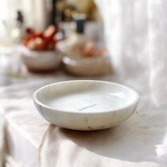 a white bowl sitting on top of a table