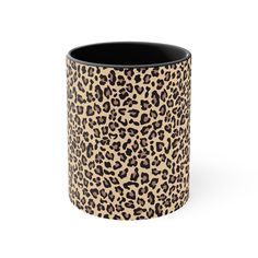 a leopard print coffee cup with black rim