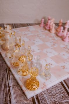 a chess board with several small glass pieces on it