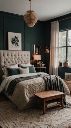 a bedroom with dark green walls and a bed in the middle, along with a rug on the floor