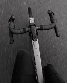 black and white photograph of the handle bars on a bicycle