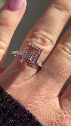 3.5Ct Emerald Cut Pink Lab Created Diamond Engagement Ring With Hidden Halo by ElistaJewel ✤ 𝐃𝐢𝐚𝐦𝐨𝐧𝐝 𝐃𝐞𝐭𝐚𝐢𝐥𝐬 ✤ ↦ Total Diamond Weight: 3.85Carats ↦ Center Diamond Shape: Emerald ↦ Center Diamond Weight: 3.5Carat ↦ Color: Fancy Pink ↦ Clarity: VS2 ↦ Side Accent Diamonds: 0.35 ctw (Round) ↦ Setting: Prong ↦ Ring Size: Size Selectable This lab-grown diamond was grown by the CVD /HTHP process. ✤ 𝐑𝐢𝐧𝐠 𝐃𝐞𝐭𝐚𝐢𝐥𝐬 ✤ ↦ Metal Purity: Solid Gold (10KT, 14KT, 18KT); 950 Platinum ↦ Met Lab Created Pink Diamond Ring, Pink Rectangle Engagement Ring, 2 Ct Diamond Ring, Pink Sapphire Engagement Ring Emerald Cut, Pink Emerald Engagement Ring, Pink Emerald Cut Engagement Ring, 5 Carat Emerald Engagement Ring, Pink Diamond Ring Engagement, Pink Diamond Wedding Ring