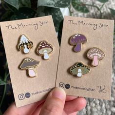 two pins with different types of mushrooms on them