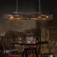 a dining room table and chairs with wine glasses on it