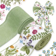 the ribbon is green with flowers and butterflies on it, along with other fabric items