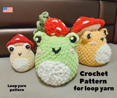 three crocheted stuffed animals with hats on them