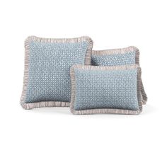 two blue pillows sitting on top of each other